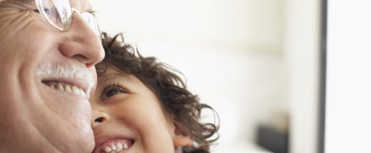 Grandfather laughing with grandson
