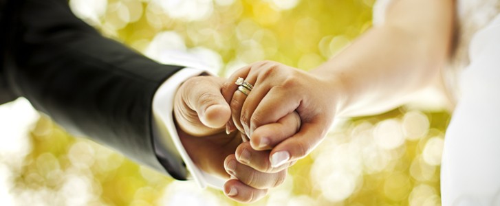 Newlywed Couple Holding Hands