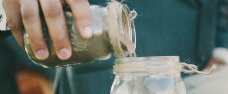 Pouring Sand into of a Jar