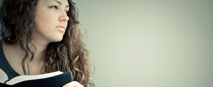Girl pondering the Word of God