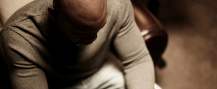 Man praying with head bowed