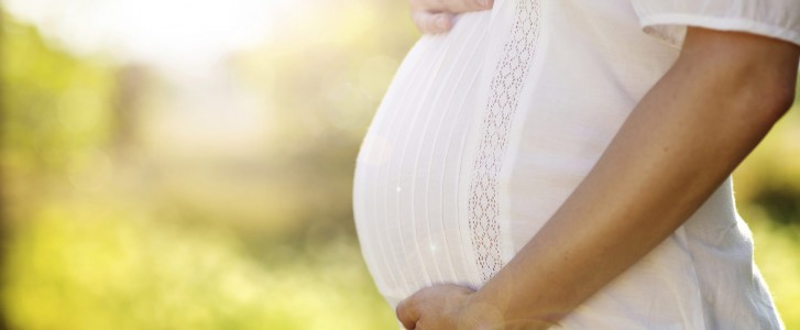 Profile of pregnant woman's belly