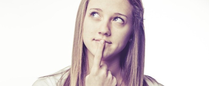 Young woman pondering a question