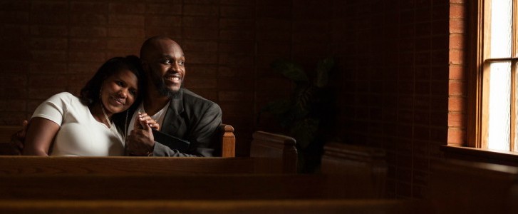 Husband and wife in church pew
