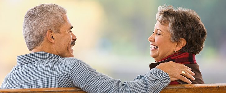 Senior married couple laughing together