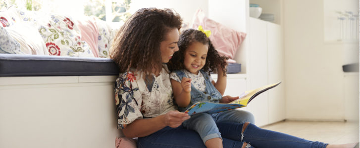Mother and daughter reading a book